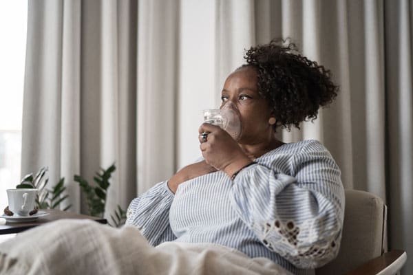 patient receiving respiratory therapy at home | TLC Your Way Hospice Care